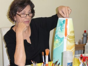 Working on her piece before the second firing